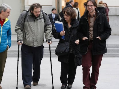 Guillermo Zapata (on crutches) with other Ahora Madrid coalition members outside City Hall on Thursday.