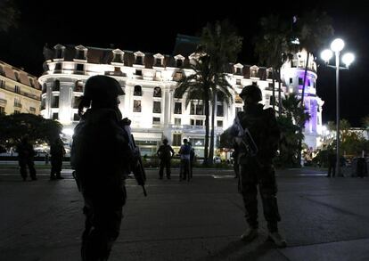 French soldiers secure the street after at least 30 people were killed in Nice, France, when a truck ran into a crowd celebrating the Bastille Day national holiday