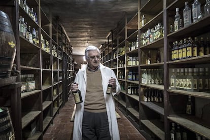 Juan Juan Micó, owner of Ayelo distilleries, with original Kola-coca bottles.