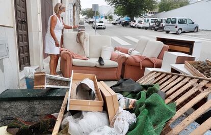 A resident of Estepa with her furniture on the street after Tuesday's extreme weather event. 