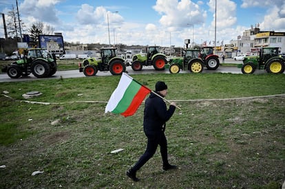 A farmer with a Bulgarian flag, during a protest to block the passage of trucks with Ukrainian grain from Romania, on March 29.