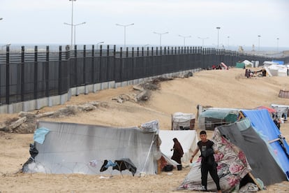 Palestinians shelter at the border with Egypt, amid fears of an exodus of Palestinians into Egypt.