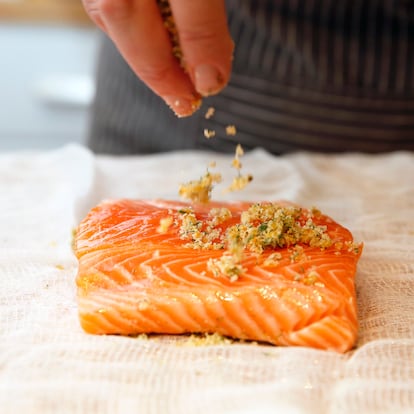 PORTLAND, ME - DECEMBER 15: Green Plate Special: The author sprinkles a citrus rub on a filet of salmon to make gravlax. (Staff photo by Ben McCanna/Portland Portland Press Herald via Getty Images)