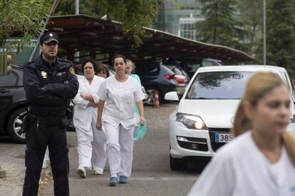Staff arrive at the Carlos III hospital in Madrid on Tuesday.