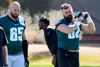 Philadelphia Eagles center Jason Kelce (62) and offensive tackle Lane Johnson (65) warm up during an NFL football Super Bowl team practice, Wednesday, Feb. 8, 2023, in Tempe, Ariz.