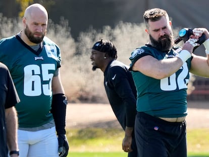 Philadelphia Eagles center Jason Kelce (62) and offensive tackle Lane Johnson (65) warm up during an NFL football Super Bowl team practice, Wednesday, Feb. 8, 2023, in Tempe, Ariz.