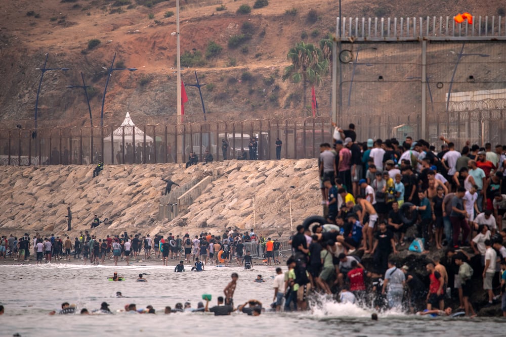 Migrants return to Morocco from the Spanish enclave of Ceuta, Friday, July 31, 2026. (AP Photo/Antonio Sempere)