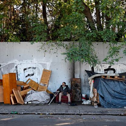 A man sits outside his makeshift house on the street in Buenos Aires on April 14, 2023. - Argentina suffers from one of the highest inflation rates in the world. According to official data, poverty reaches 39.2% of the population. During March 2023, inflation marked 7.7% and 104.3 in the last twelve months. (Photo by Luis ROBAYO / AFP) (Photo by LUIS ROBAYO/AFP via Getty Images)