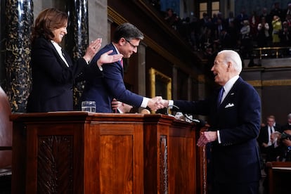 Joe Biden shakes hands with the Speaker of the House, Republican Mike Johnson