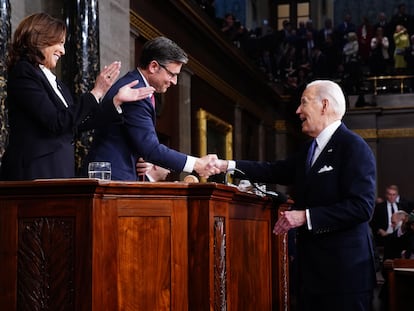 Joe Biden shakes hands with the Speaker of the House, Republican Mike Johnson