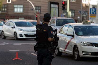 A police officer enforces the coronavirus restrictions on mobility in Madrid.