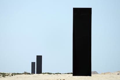 A view of three of the four gigantic monoliths by American artist Richard Serra, titled “East-West/West-East,” which stand in the desert of Zekreet, Qatar. 