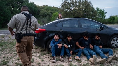 Migrants detained during Operation Lone Star in Bracketville, Texas, March 2023.