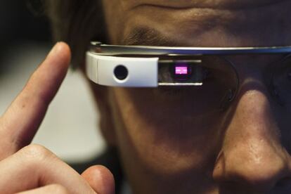 An employee demonstrates how a pair of Google Glass connected glasses are capable of reading barcodes on day three of the Mobile World Congress in Barcelona, Spain, on Wednesday, Feb. 26, 2014. Photographer: Angel Navarrete/Bloomberg