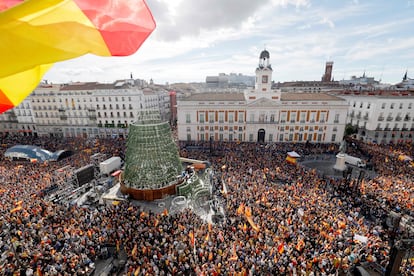 Demonstrators hold banners and Spain's flags during a protest called by right-wing opposition against an amnesty bill for people involved with Catalonia's failed 2017 independence bid, on Puerta del Sol square in Madrid on November 12, 2023.