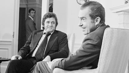 (Original Caption) 7/26/1972-Washington, DC-Singer Johnny Cash, who has given shows in prisons across the nation, appears before a Senate subcommittee on national penitentiaries which is conducting hearings on a federal prison reorganization act. Following his appearance Cash paid a visit to President Nixon at the White House to discuss the testimony.
