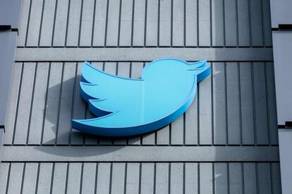 In this file photo taken on October 28, 2022 the Twitter logo is seen on a sign on the exterior of Twitter headquarters in San Francisco, California.