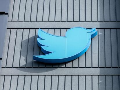 In this file photo taken on October 28, 2022 the Twitter logo is seen on a sign on the exterior of Twitter headquarters in San Francisco, California.