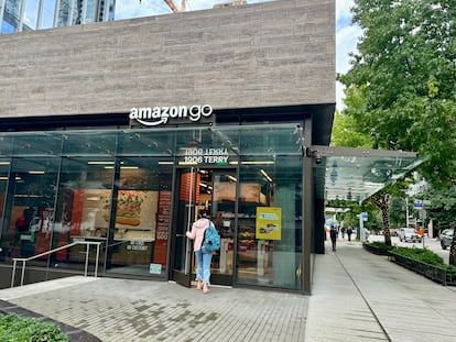A girl walks into an Amazon Go supermarket in Seattle.