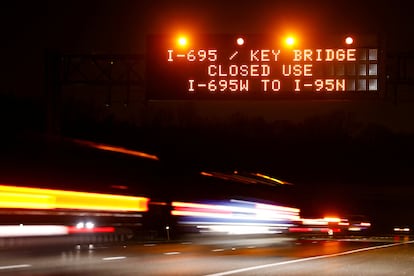 Illuminated highway signs warn drivers of an alternate detour following the Francis Scott Key Bridge accident in Baltimore on Tuesday. 