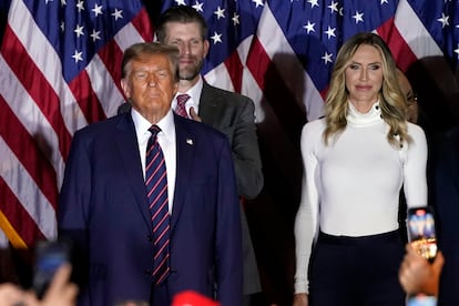 Republican presidential candidate Donald Trump arrives to speak at a primary election night party in Nashua, N.H., Tuesday, Jan. 23, 2024, with Eric and Lara Trump.