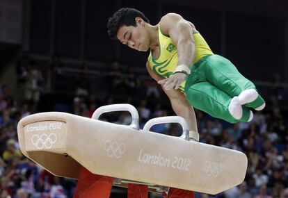 Brazilian gymnast Sergio Sasaki Junior performs on the pommel horse during the artistic gymnastics men's individual all-around competition at the 2012 Summer Olympics, Wednesday, Aug. 1, 2012, in London. (AP Photo/Julie Jacobson)