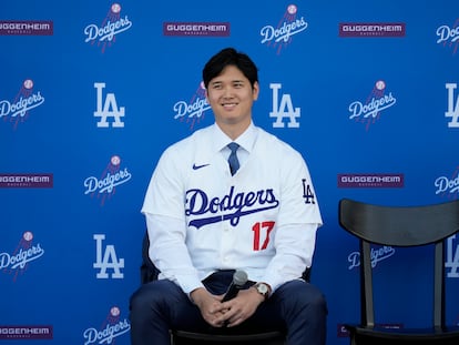 Los Angeles Dodgers' Shohei Ohtani answers questions during a news conference at Dodger Stadium, December 14, 2023.