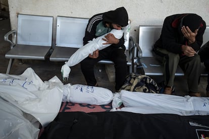 Palestinians mourn relatives killed in the Israeli bombardment of the Gaza Strip in Rafah, Saturday, Jan. 13, 2024.