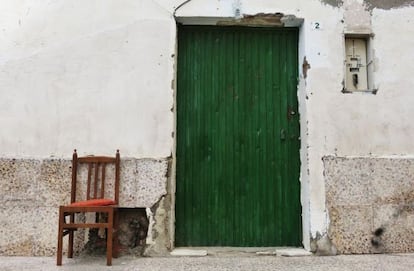 A chair at the entrance to a farm building indicates sex is for sale inside.