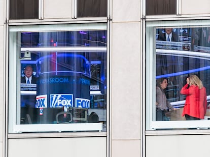 Two women inside the headquarters of the Fox network in New York, on Wednesday, April 19.