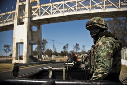 A navy officer patrols a highway near Toluca in Mexico state on January 29.