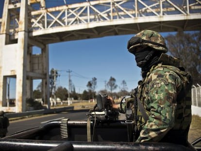 A navy officer patrols a highway near Toluca in Mexico state on January 29.