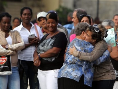 Two women in Havana celebrate obtaining a visa to travel to the US.