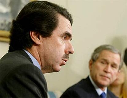 José María Aznar y George W. Bush.