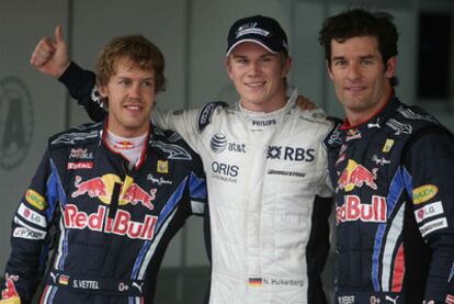 Hulkenberg, en el centro, celebra la consecución de la <i>pole</i> en Interlagos acompañado de Vettel y Weber.
