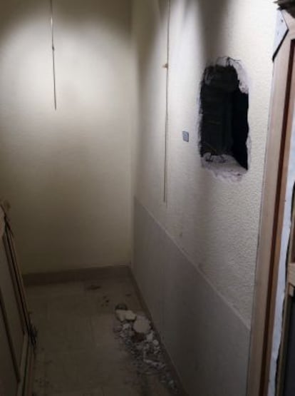 Gallery owners took this photograph of the hole made in the wall by the burglars.