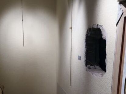 Gallery owners took this photograph of the hole made in the wall by the burglars.