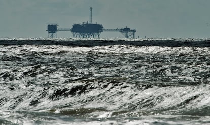 An oil and gas drilling platform stands offshore in Alabama, October 5, 2013