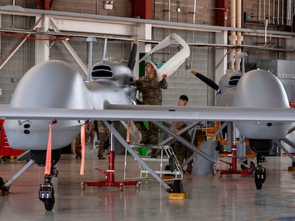 U.S. Army personnel perform maintenance on long-range drones at Fort Huachuca in Sierra Vista, Ariz