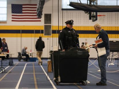 A woman votes in the Massachusetts primary on Super Tuesday.