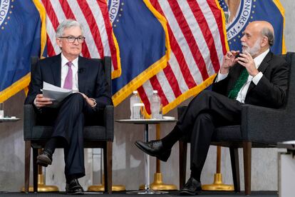 Former Federal Reserve Chairman Ben Bernanke, right, accompanied by Federal Reserve Chairman Jerome Powell, left, speaks during the Thomas Laubach Research Conference at the William McChesney Martin Jr. Federal Reserve Board Building in Washington, Friday, May 19, 2023.