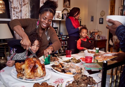 Mother and daughter carving turkey