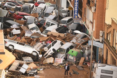 Cars piled in the street with other debris after flash floods on October 30, 2024 in the Sedaví area of Valencia, Spain. 