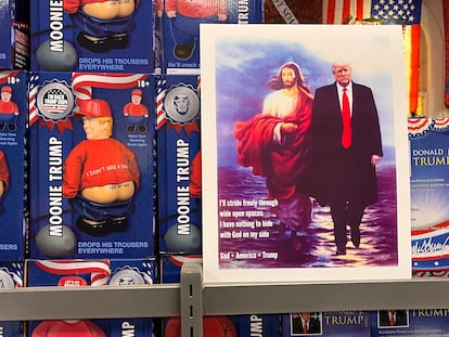 A figurine of Donald Trump that, when you pull down its pants, reveals the phrase "kiss my ass," sits next to a heavenly montage featuring the former president alongside Jesus Christ.