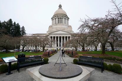 The sun dial near the Legislative Building is shown under cloudy skies, March 10, 2022, at the state Capitol in Olympia, Wash.