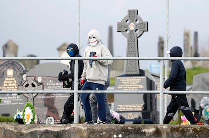 Masked youth with petrol bombs are seen as Republican protesters opposed to the Good Friday Agreement parade in Londonderry, Northern Ireland, Monday, April 10, 2023