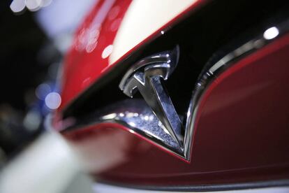 FILE- This Sept. 30, 2016, file photo shows the logo of the Tesla model S at the Paris Auto Show in Paris, France. The Autopilot system on a Telsa Model S may have helped the California Highway Patrol stop the car after its driver fell asleep on a freeway. (AP Photo/Christophe Ena, File)