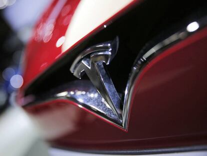 FILE- This Sept. 30, 2016, file photo shows the logo of the Tesla model S at the Paris Auto Show in Paris, France. The Autopilot system on a Telsa Model S may have helped the California Highway Patrol stop the car after its driver fell asleep on a freeway. (AP Photo/Christophe Ena, File)
