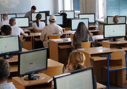 Students take the Ukrainian final state examination, a test after high school for those who hope to attend university, in Warsaw, Poland, Wednesday June 7, 2023.