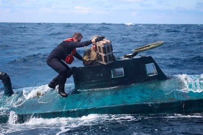 The U.S. Coast Guard boards a semi-submersible boat, which was carrying cocaine that had a market value of more than $165 million, in September 2019.